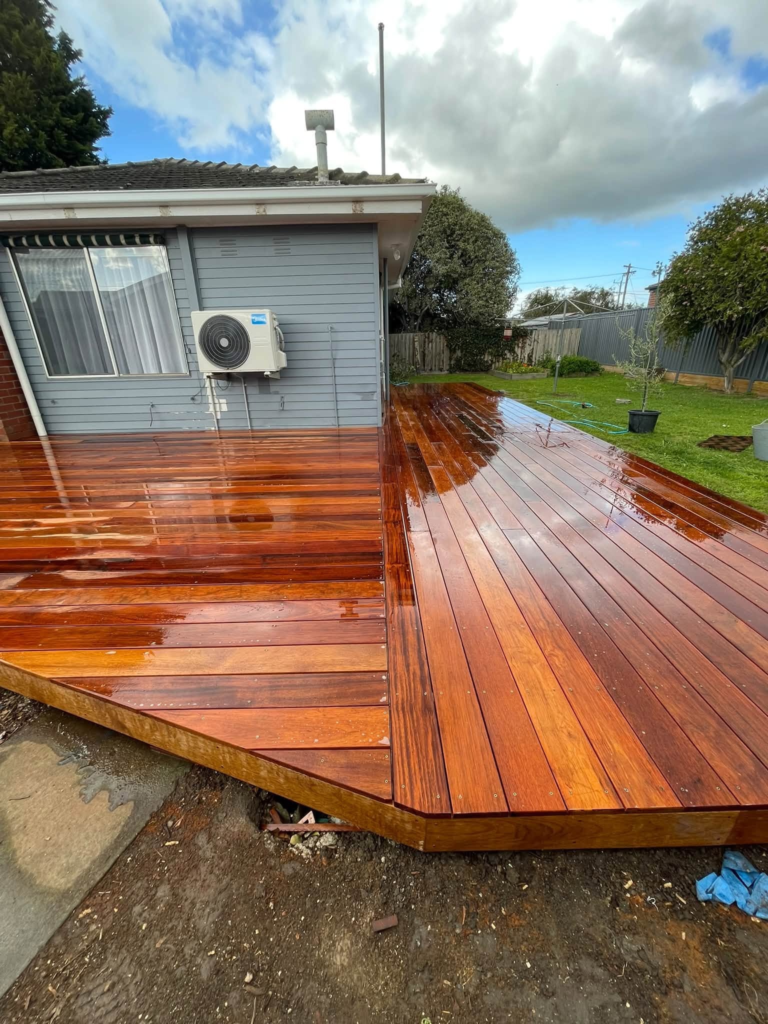Merbau timber decking wrapping around the corner of a home