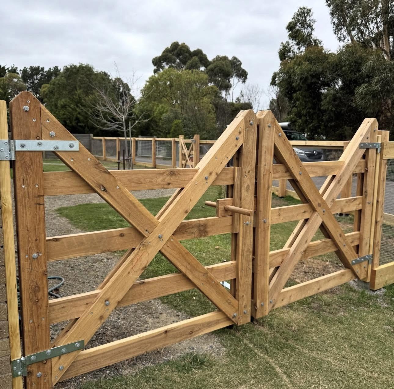 Timber garden gates with diagonal bracing and visible joinery